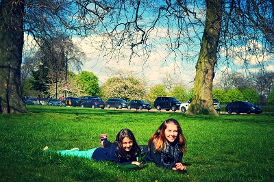 girls on the grass of kensington garden