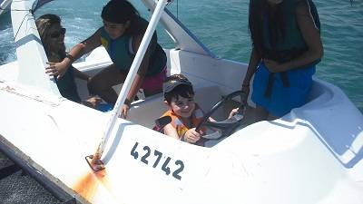 child in a speed boat eilat