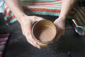 child holding fresh cocoa on the chocolate tour