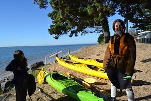 two girls getting read to go kayaking