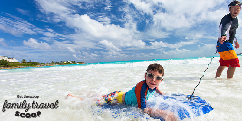 Father & son boogie boarding in Nassau