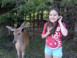 girl with a deer at parc omega