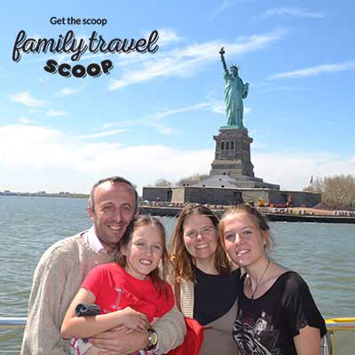 family near statue of liberty