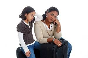 tired mother and daughter traveling