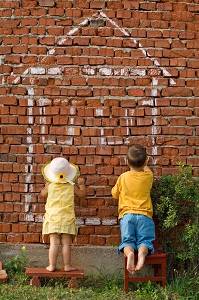 children painting a house