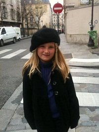 girl wearing berret on paris street