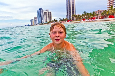 boy in ocean at Miami