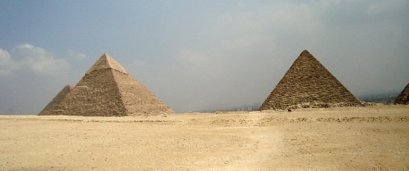 family in front of the pyramid