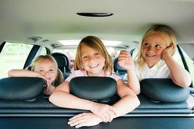 3 girls in a car on a road trip