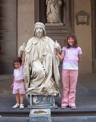 Kids with a love statue in Florence, Italy