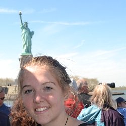 nyc taxi with statue of liberty