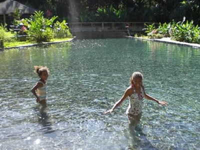 Children playing in natural pool in YS Falls